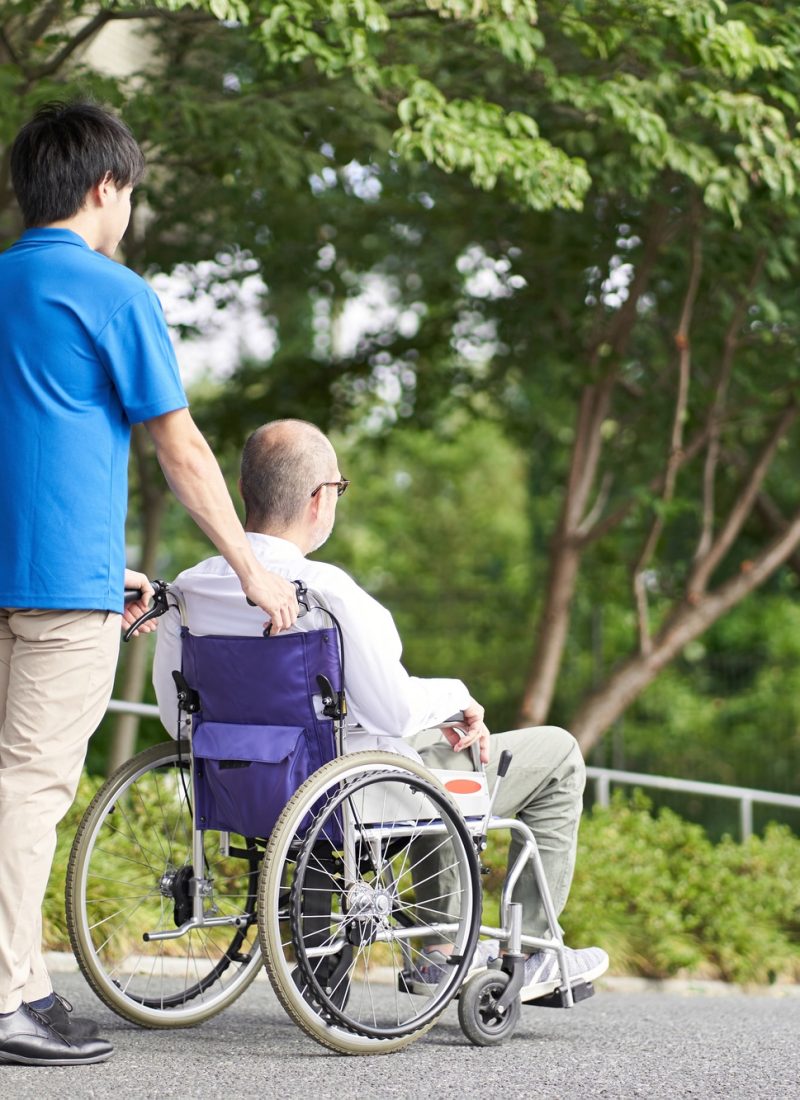 Caregiver supporting the elderly in wheelchairs